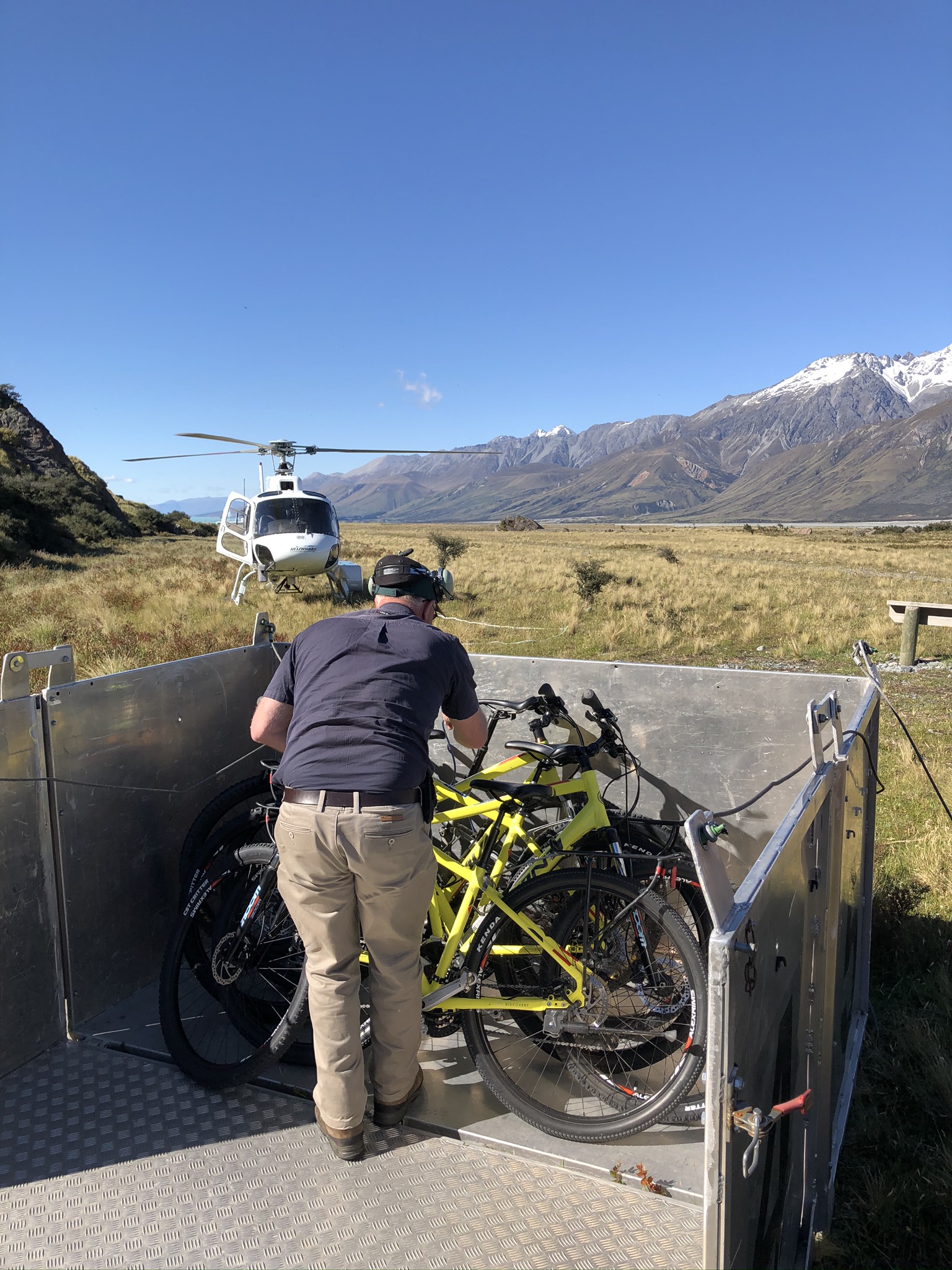 The pilot unloads our crate of bikes